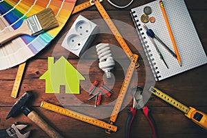 Home improvement and repair concept - work tools and objects on wooden table photo