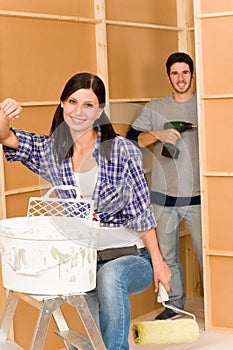 Home improvement: young couple fixing new house