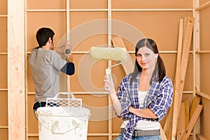 Home improvement: young couple fixing new house