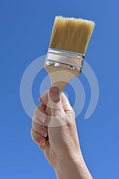 Home improvements and DIY,  hand holding paint brush