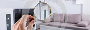 Home Inspection Using Magnifying Glass