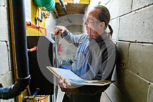 Home inspector point at machinery photo