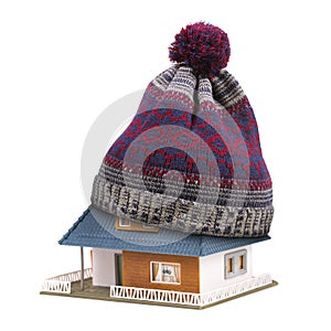 Home insulation or insurance concept. hat on house roof isolated