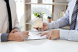 Home insurance agents offer terms and conditions to clients and get approval, home purchase and insurance contracts