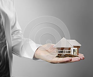 Home insurance concept in hand