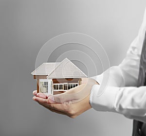 Home insurance concept in hand photo