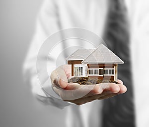 Home insurance concept in hand photo