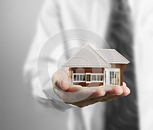 Home insurance concept in hand photo