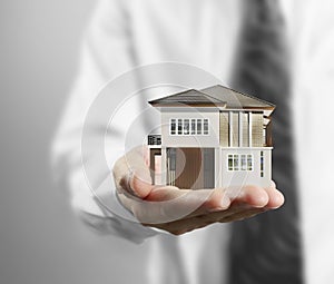 Home insurance concept in hand photo