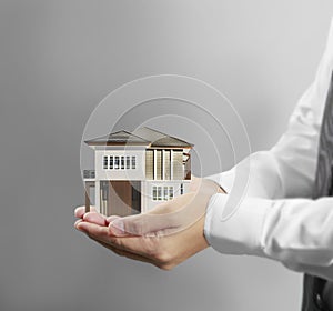 Home insurance concept in hand photo