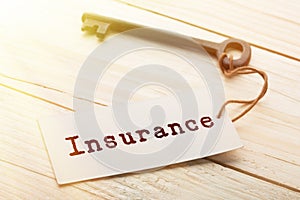 home insurance concept - old key with tag