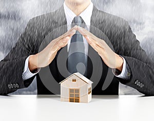 Home insurance concept under rain