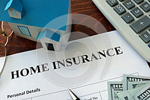 Home insurance form and dollars.