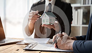 Home Insurance and Real estate investment concept, new client after signing agreement contract with approved property application
