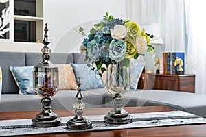 Home interior decor,metal , bouquet in glass vase photo