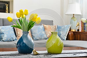 Home interior decor, tulip bouquet in vase photo
