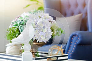 Home interior decoration with american Newport style, living room have a blue sofa and gray pillow with white bird and flowers,