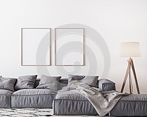 Home interior mock-up with gray sofa and wooden floor lamp in bright living room, two wooden frame mockup on white wall