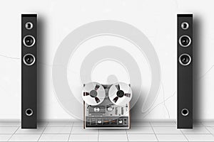 Home interior - Two tower loudspeaker and retro reel to reel tapes recorder enclosure white wall