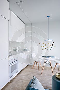 Home interior with white kitchenette