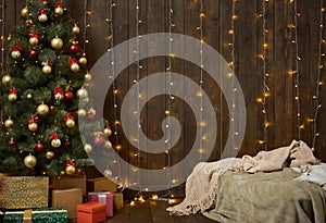 Home interior with wooden wall, bed, christmas tree and lights,