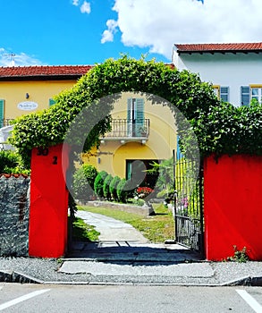 Italy home with shutters and lovely garden gate entrance