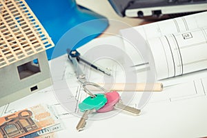 Home keys, currencies euro, electrical diagrams and accessories for engineer jobs, building home cost concept