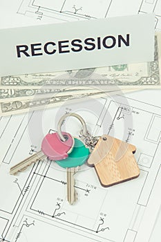 Home keys, dollar and inscription recession on housing plan. Crisis of real estate market. Reduced housing prices