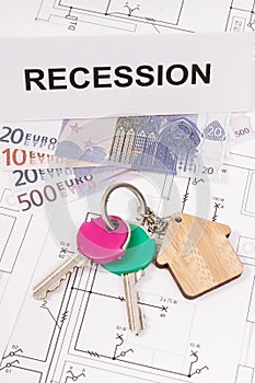 Home keys, euro and inscription recession on housing plan. Crisis of real estate market. Reduced housing prices