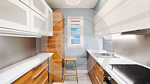 Home kitchen interior with furniture and window