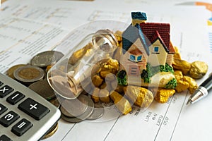 Home loan bank debit statement with house miniature