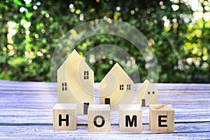 Home loans,saving for a real estate concept,Present by home and wooden cube.