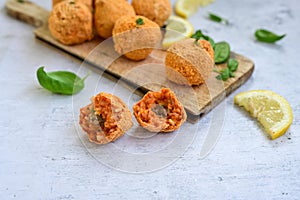 Home made Arancini bolognese . Italian fried rice balls wi Italian street food.