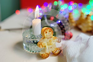 Home made bakery for christmas holidays. Christmas lights, candle flame. Food art. Gingerbread. New year mood. Celebrate