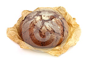 Home-made bread in a pergament paper photo