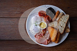 Home-made breakfast includes: Eggs, sausages, bacon. Fried breaded fish, toasted tomatoes, grilled mushrooms and butter are