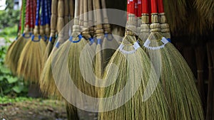 Home made broomsticks hanging on a shop