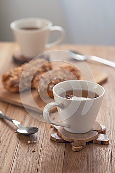 Home made cake eclairs. Traditional eclairs, profitroles classic, eclairs french. Sweet chocolate eclairs on wooden table