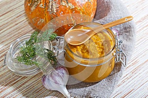 Home-made canning of the autumn harvest, vegetable vegetarian diet healthy food, spicy mashed caviar from orange pumpkin, carrots