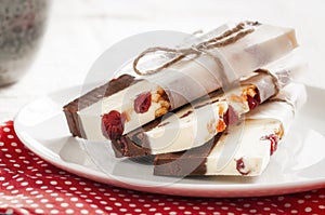 Home made Chocolate bars with red fruits and orange