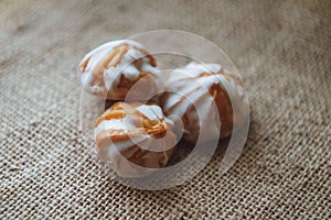 Home made choux cream on white plate. Over on wood table. Top view.