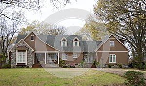 Home Made with Cobblestone and Brown Stucco.