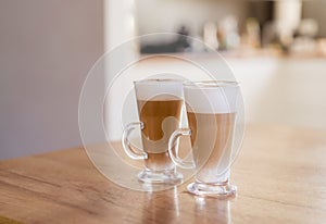 Home made coffee Cafe Macchiato on wooden table. photo