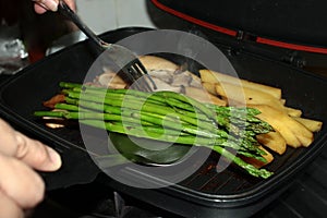 Home made ,Cooking pork steak with herb in double pan.