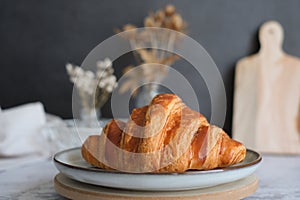 Home made croissant on the kitchen table top. pastry and bakery banner or breakfast concept