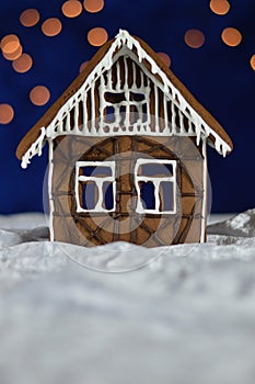 Home made gingerbread house with bokeh sky