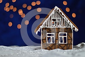 Home made gingerbread house with bokeh sky