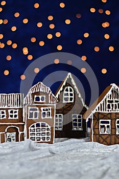 Home made gingerbread village with bokeh sky