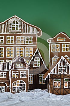 Home made gingerbread village with green background