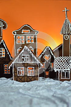 Home made gingerbread village orange background